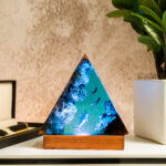 Handmade Ocean Triangle Resin Lamp featuring an intricate ocean-themed design, perfect for adding a nautical touch to any space.